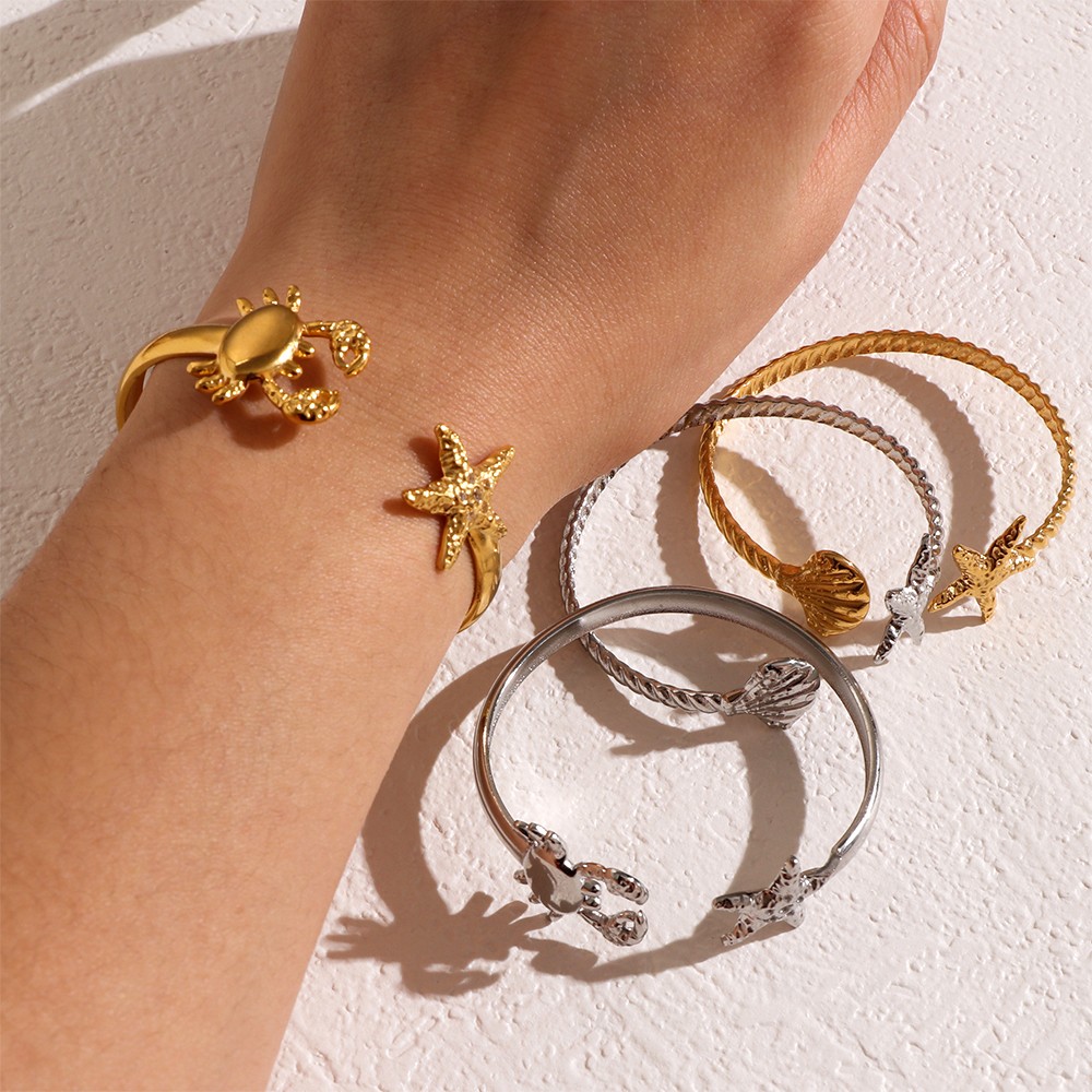 Ocean Inspired Stainless Steel Bangles with Seashell Starfish and Crab Motifs