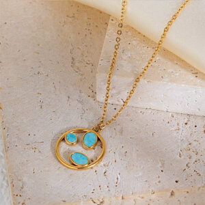 This circle stone necklace is a symbolic piece of jewelry that beautifully represents life’s journey. Designed with a polished golden ring and three delicate leaf-shaped inlays, it combines natural stones, quiet luxury, and deep meaning, making it an unforgettable accessory or gift for any occasion.