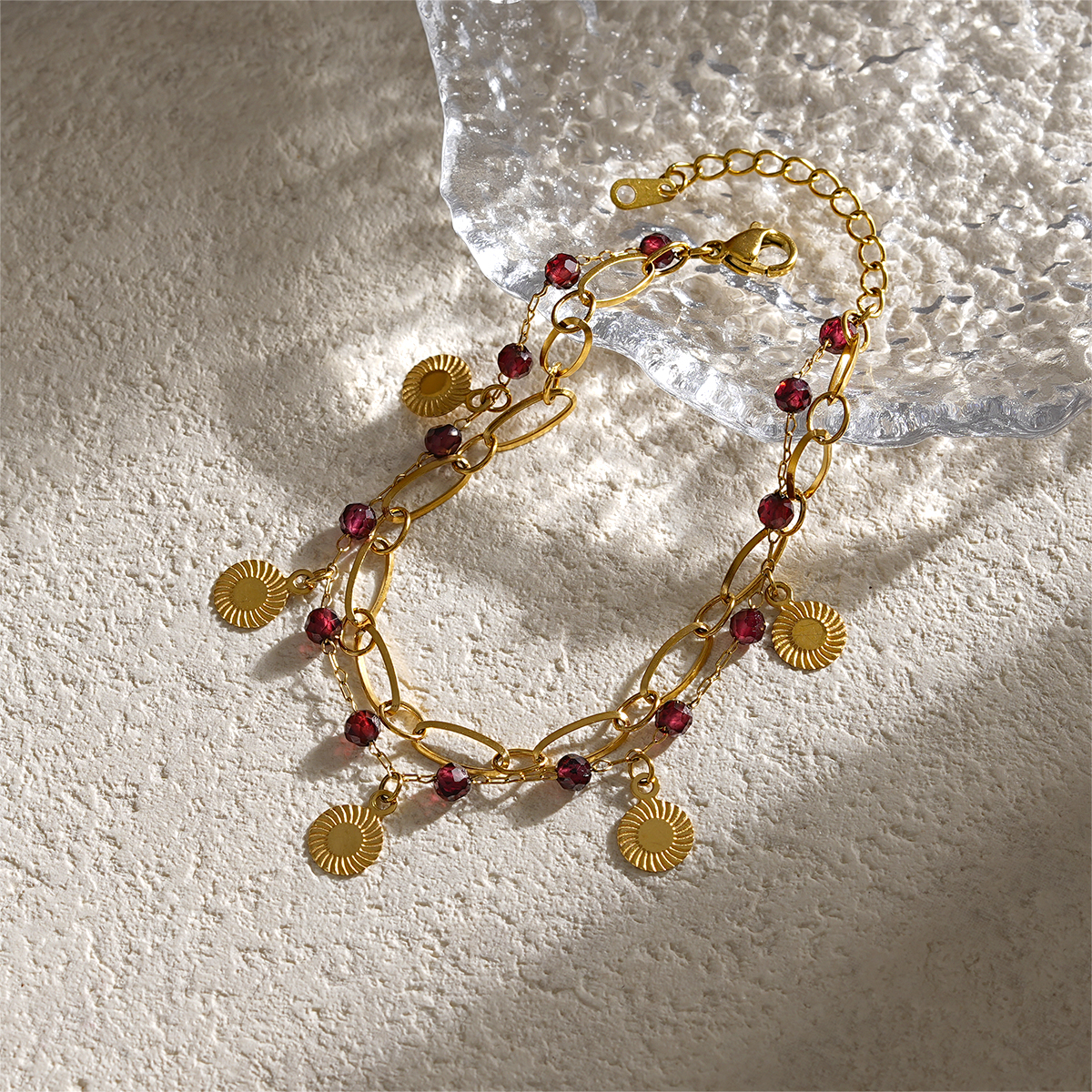 Double Layer Gold Bracelets Featuring Faceted Stones And Unique Charms