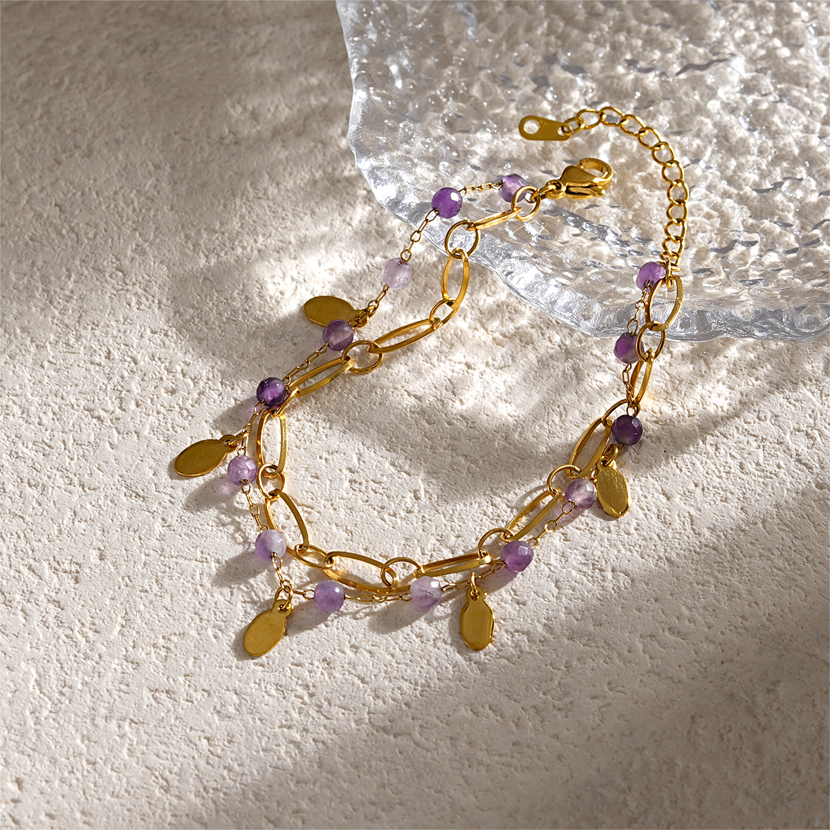 Double Layer Gold Bracelets Featuring Faceted Stones And Unique Charms