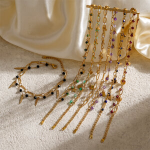 Double Layer Gold Bracelets Featuring Faceted Stones And Unique Charms