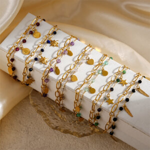 Double Layer Gold Bracelets Featuring Faceted Stones And Unique Charms