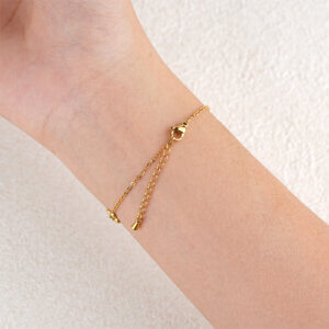 Delicate Gold Flower Charm Bracelet with Red Zircon Accent